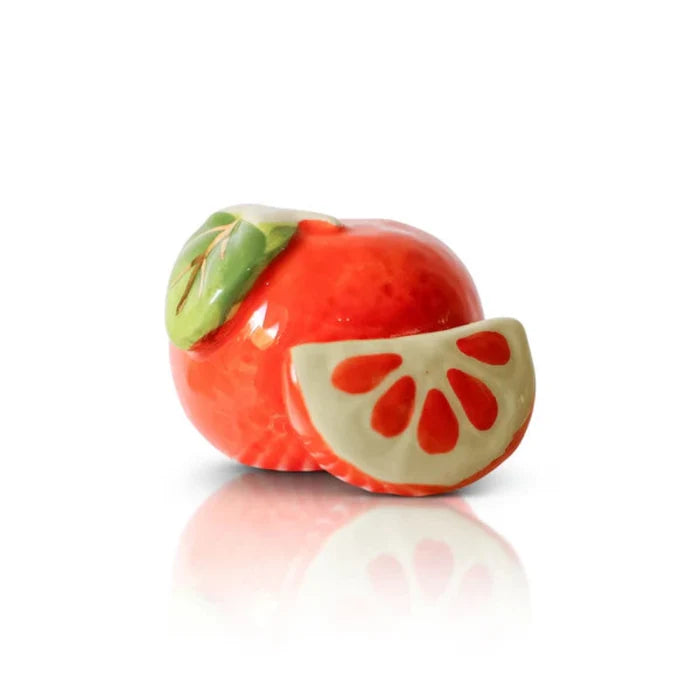 Nora Fleming Mini Decorative item Cutie Orange and Slice with green Leaf on a white background