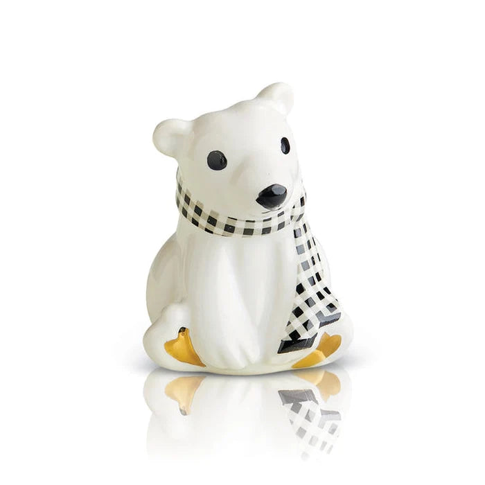 Beautiful polar bear with a black and white scarf.
