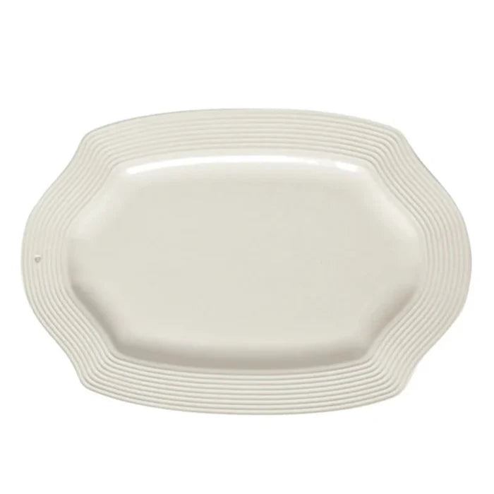 Nora Fleming White ceramic rectangle platter with wavy edge on a white background