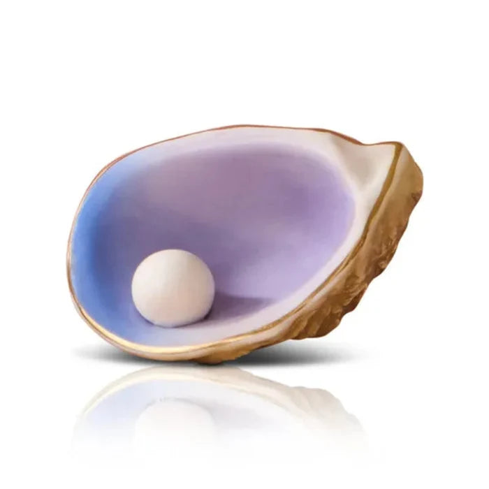 Seashell with a pearl inside on a white background