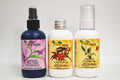 Three bottles of organic oils with labels on a white background