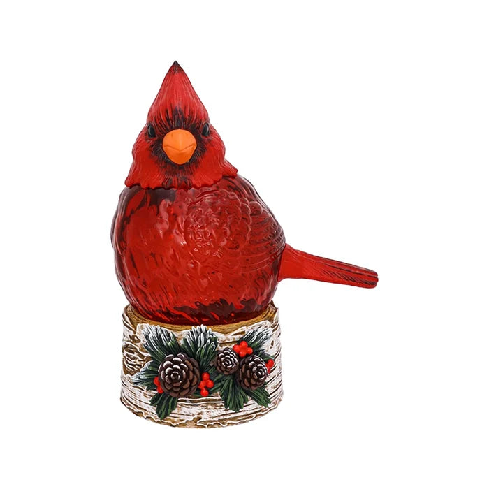 Red cardinal bird figurine on a white background