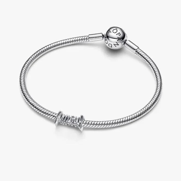 Silver bracelet with a TEXT AMOUR  charm on a white background