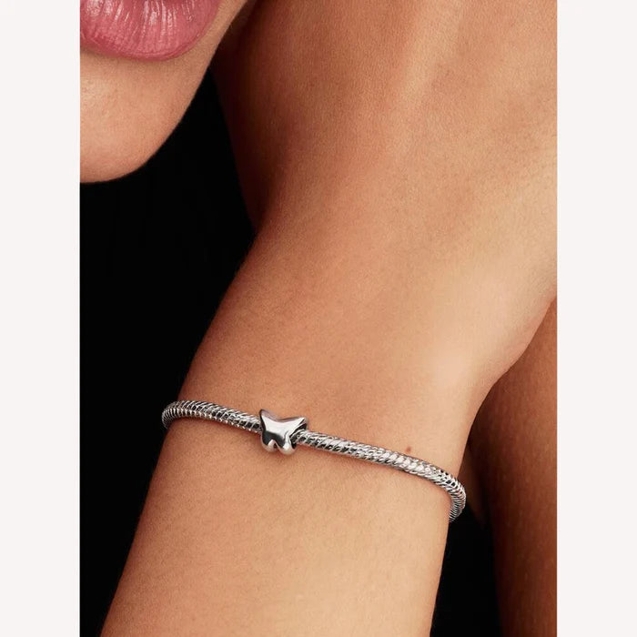 This Pandora Butterfly Mini Charm adds a delicate and graceful touch to your personalized jewelry collection.