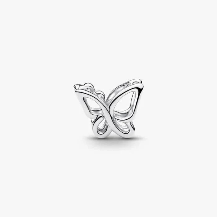 Silver butterfly-shaped earring on a white background