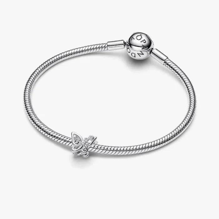 Silver bracelet with a butterfly charm on a white background