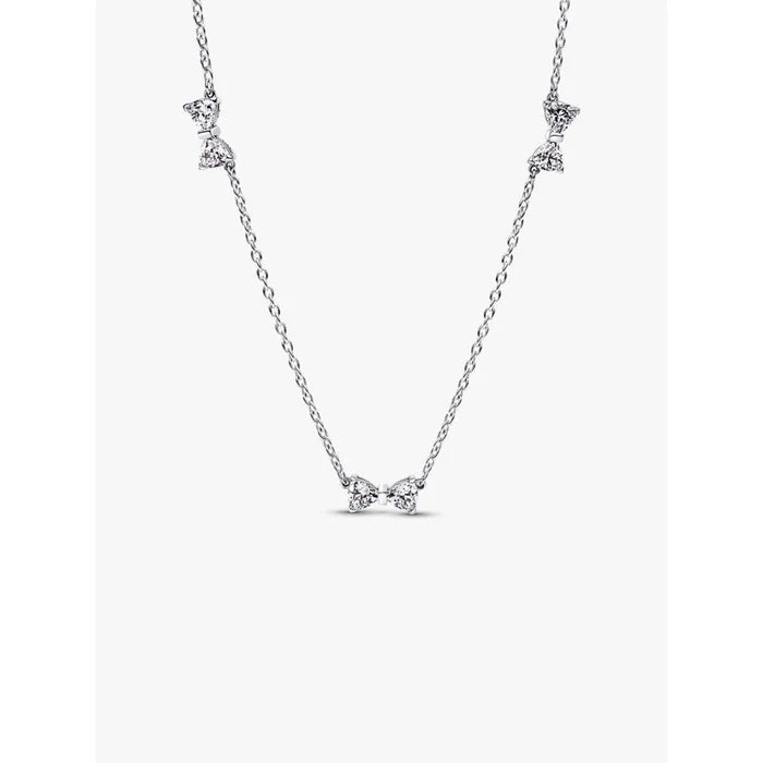 Pandora Clear Bow Station Chain Necklace displayed against a white background, featuring multiple cubic zirconia bow stations on a sterling silver chain.