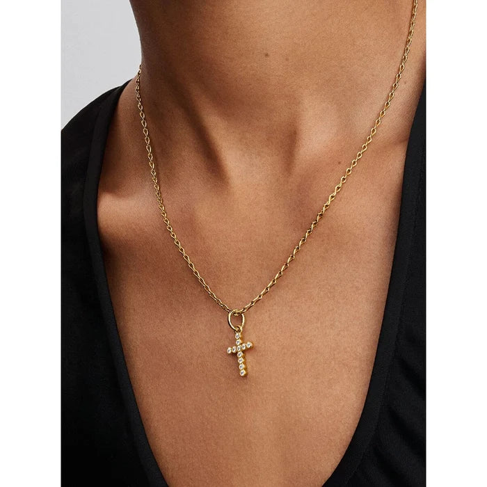 The Pandora Cross Dangle Charm in Gold brings a timeless symbol of faith to your bracelet stack.
