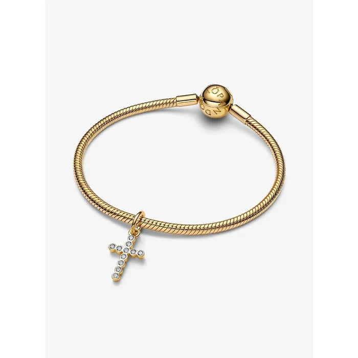The Pandora Cross Dangle Charm in Gold brings a timeless symbol of faith to your bracelet stack.