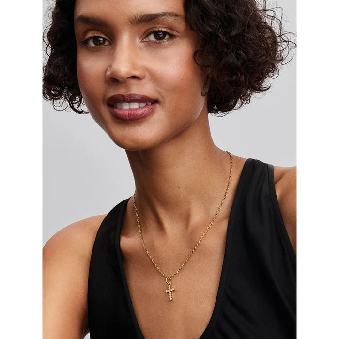 The Pandora Cross Dangle Charm in Gold brings a timeless symbol of faith to your bracelet stack.