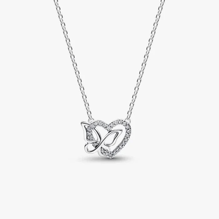 Silver necklace with a heart and butterfly shaped charm on a white background