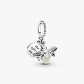 A charm featuring a bee and a heart, symbolizing love and nature.