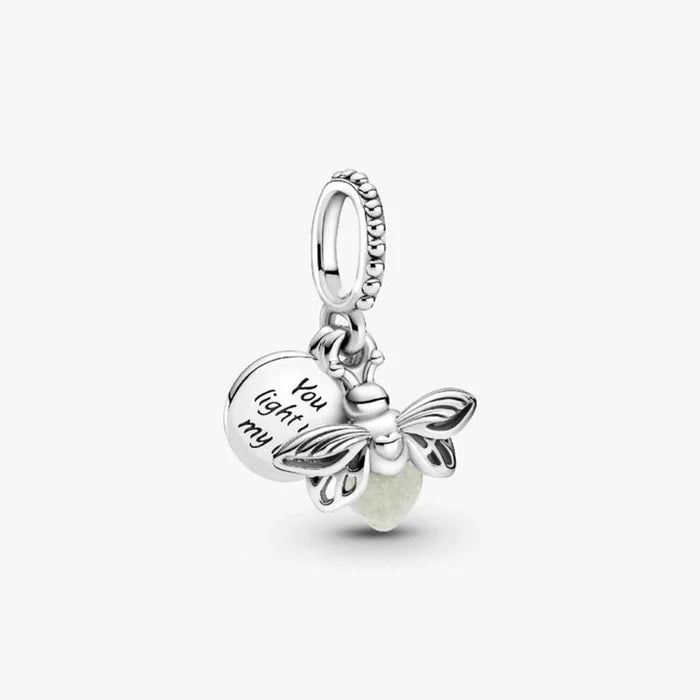 A charm featuring a bee and a heart, symbolizing love and nature.