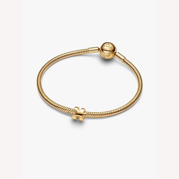 Gold bracelet on a light background