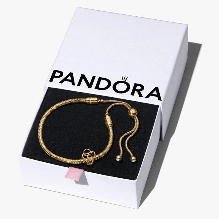 Gold bracelet in a Pandora box on a white background