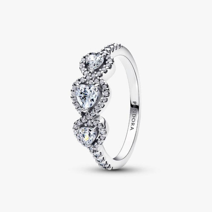 Pandora Halo Heart Trilogy Ring in sterling silver with heart-shaped halo stones, standing upright vertically.