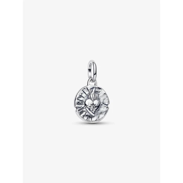 Close-up of the Pandora Heart Medallion Charm with a raised flaming heart design on the front.