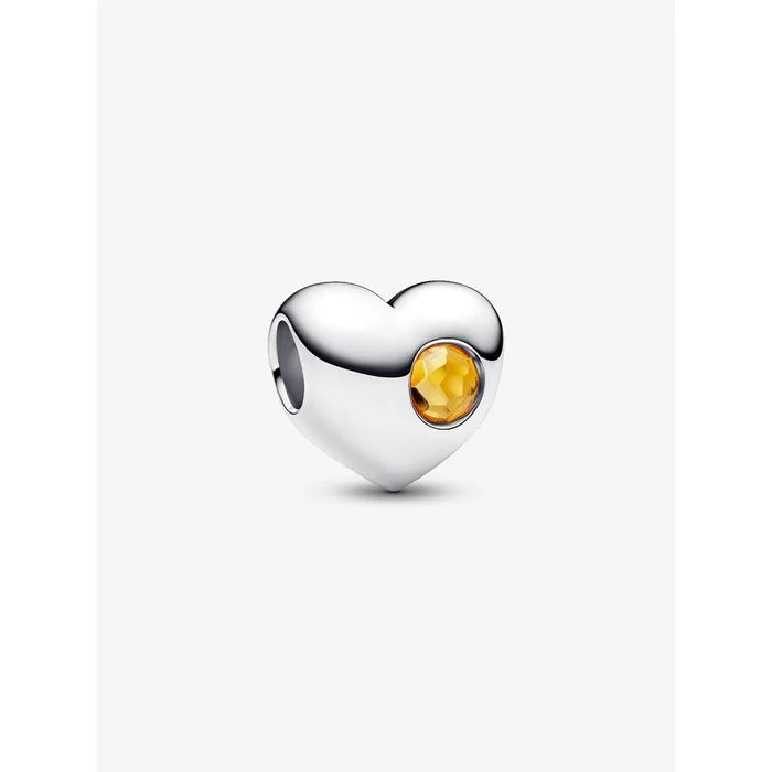 Sterling silver heart charm with honey-yellow crystal centerpiece.