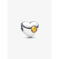 Sterling silver heart charm with honey-yellow crystal centerpiece.
