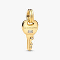 Gold key-shaped pendant with 'No Duplicates' engraving on a white background