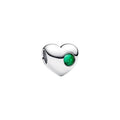 A standalone silver Pandora heart-shaped charm with a faceted green stone accent on a white background.