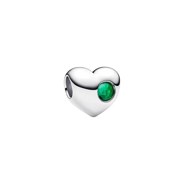 A standalone silver Pandora heart-shaped charm with a faceted green stone accent on a white background.