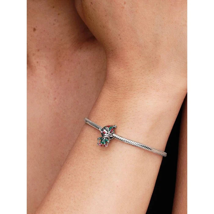 Pandora Moveable Elf Charm worn on a silver bracelet, showing the festive red and green enamel details.