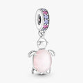Pink turtle charm adorned with purple stones, showcasing a playful design perfect for a charm bracelet.