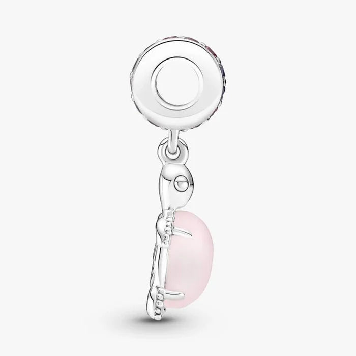 Delightful pink turtle charm featuring purple stones, designed to enhance the beauty of charm bracelets.