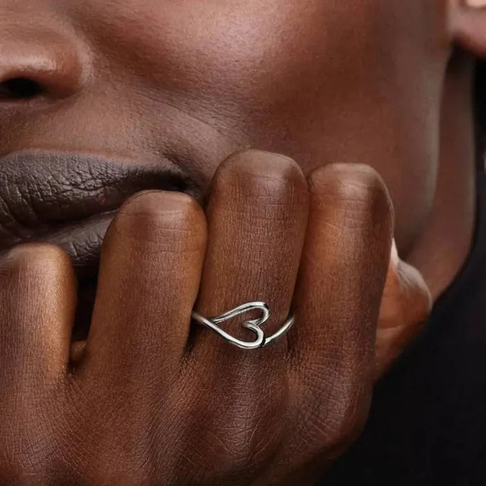 Pandora Organically Shaped Heart Small Ring in sterling silver worn on a woman’s finger, close-up view.