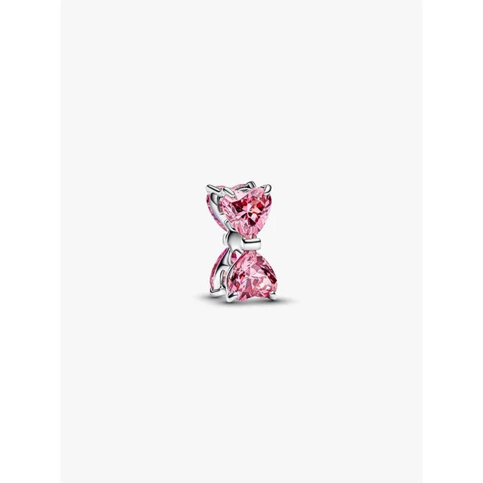 Close-up of the Pandora Pink Bow Charm with two sparkling pink heart stones forming a bow design.