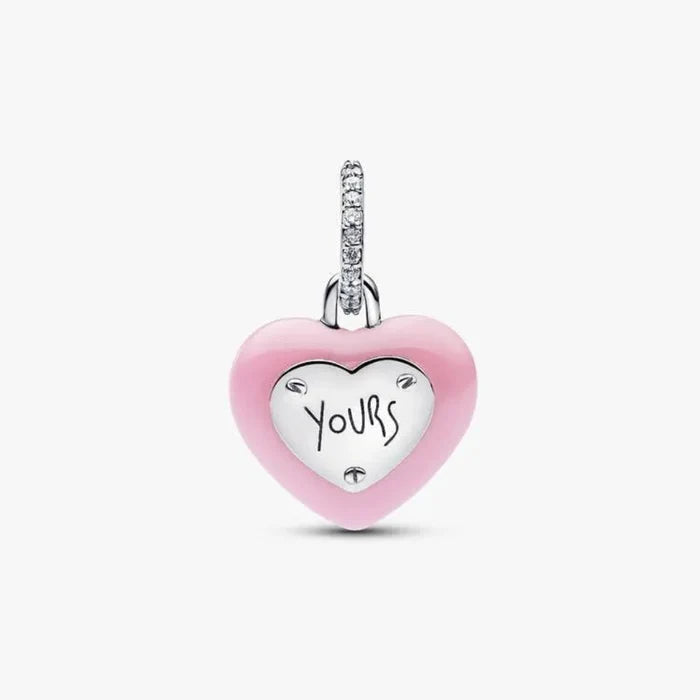 Heart-shaped pendant with 'Yours' engraving on a white background