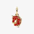 Gold pendant with red design on a white background