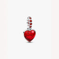 Heart-shaped pendant with red stone accents on a light background