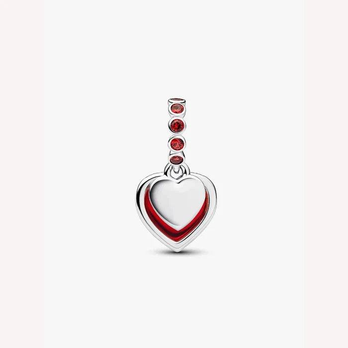 Heart-shaped charm with red accents on a light background