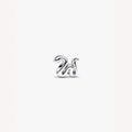 Silver charm stylized snake on a white background