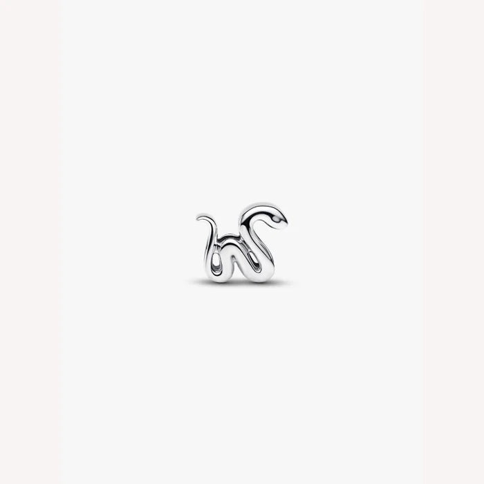 Silver snake shaped charm on a light background