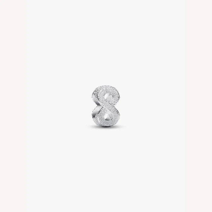 Silver number 8 charm on a white background