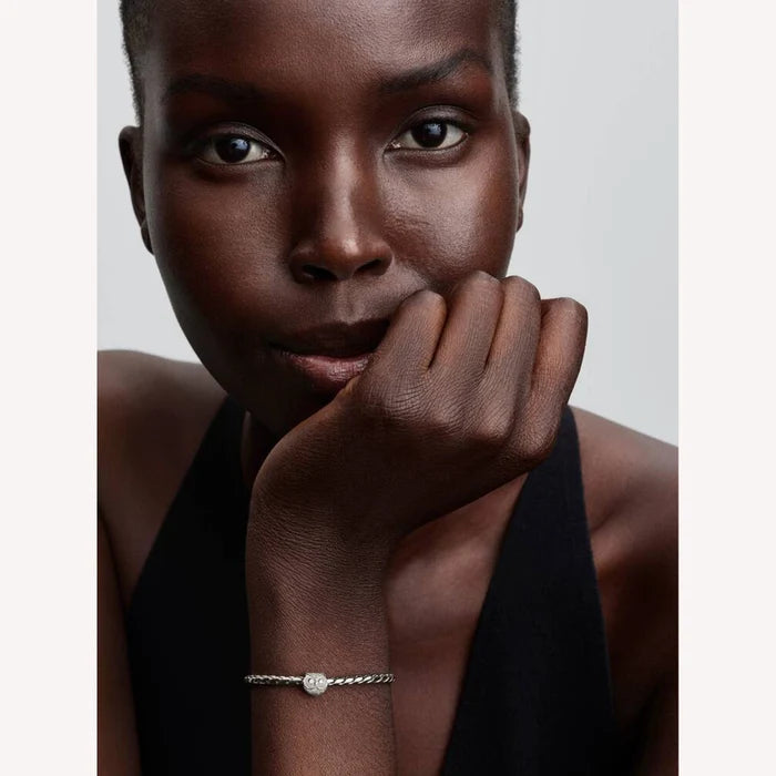 Woman wearing a bracelet with a white background