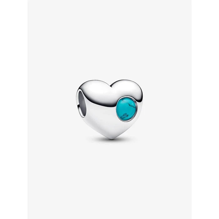 Close-up of PANDORA Turquoise Stone Heart Charm with genuine turquoise gemstone in sterling silver.