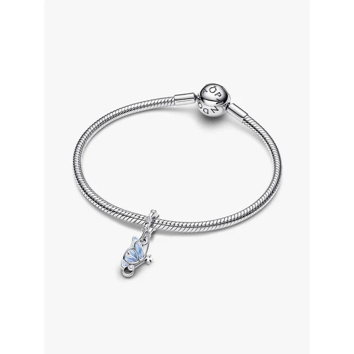 Pandora Winged Dangle Charm displayed on a silver Pandora Moments bracelet with blue enamel butterfly detail.