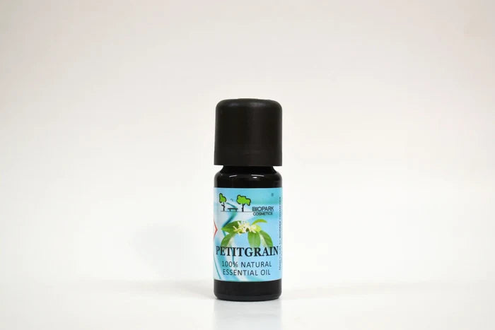Bottle of Petitgrain essential oil on a white background