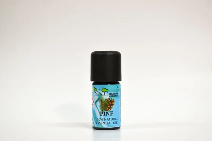 Bottle of pine essential oil on a white background