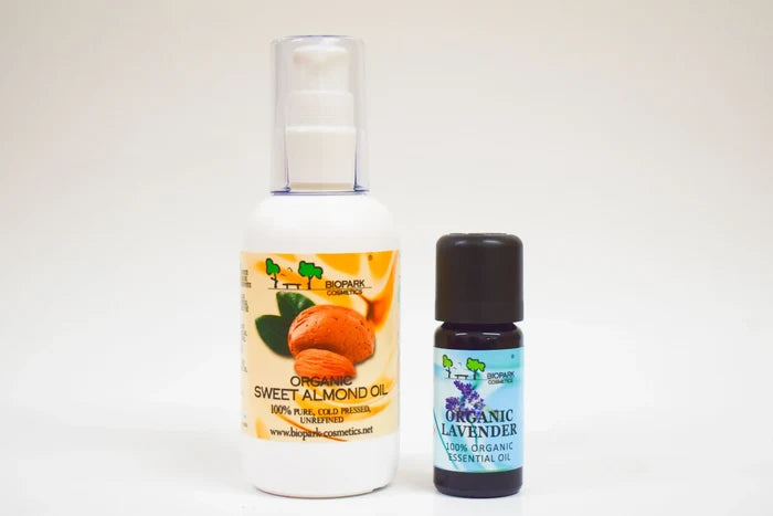 Two bottles of organic oils on a white background