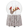 Roman musical glitter dome featuring colorful cardinals perched on a decorative branch with swirling glitter.