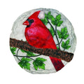 Decorative stone with a red cardinal bird on a branch