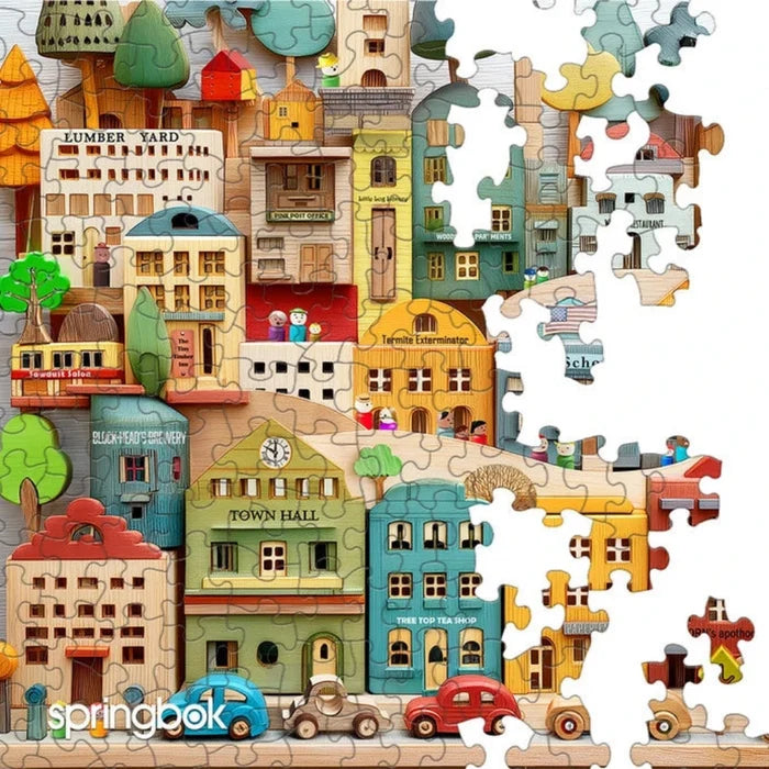Wooden puzzle of a town with buildings and cars, featuring Springbok branding.