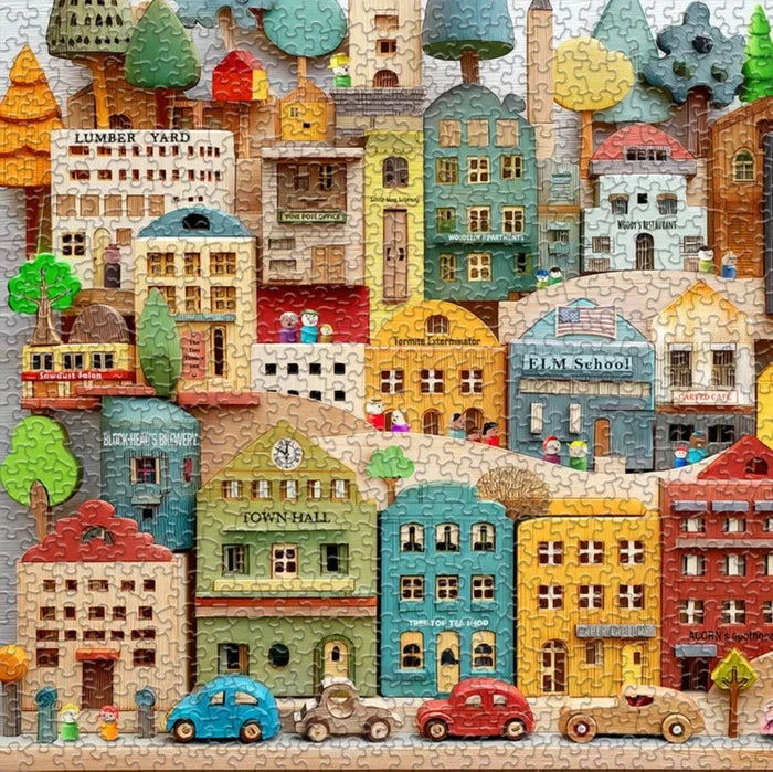 Jigsaw puzzle box featuring a colorful town scene with 'springbok' branding.