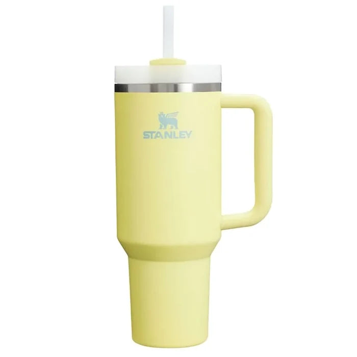 Yellow tumbler with handle and straw lid on a white background