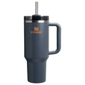 Navy blue Stanley mug with handle and straw on a white background
